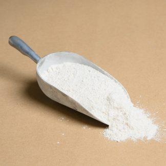 A scoop of Chlorinated-Rubber on a beige background.