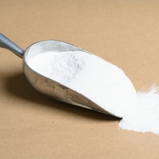 A scoop of Soluble-Glutinous-Rice-Starch powder on a brown surface.