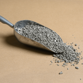 A scoop of gravel on a beige background.